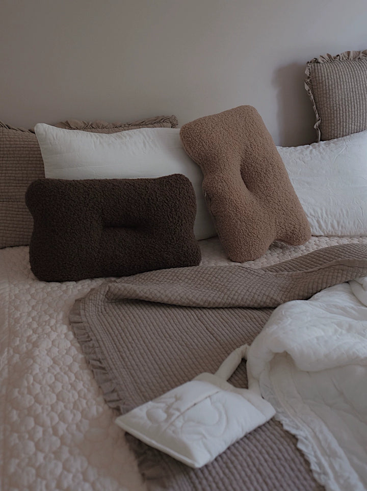 Earthy brown boucle pillow