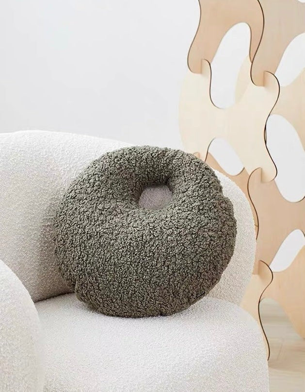 Cosik Home Abstract Bouclé Donut Throw Pillow in olive green with a textured, curly fabric and an off-center cutout.