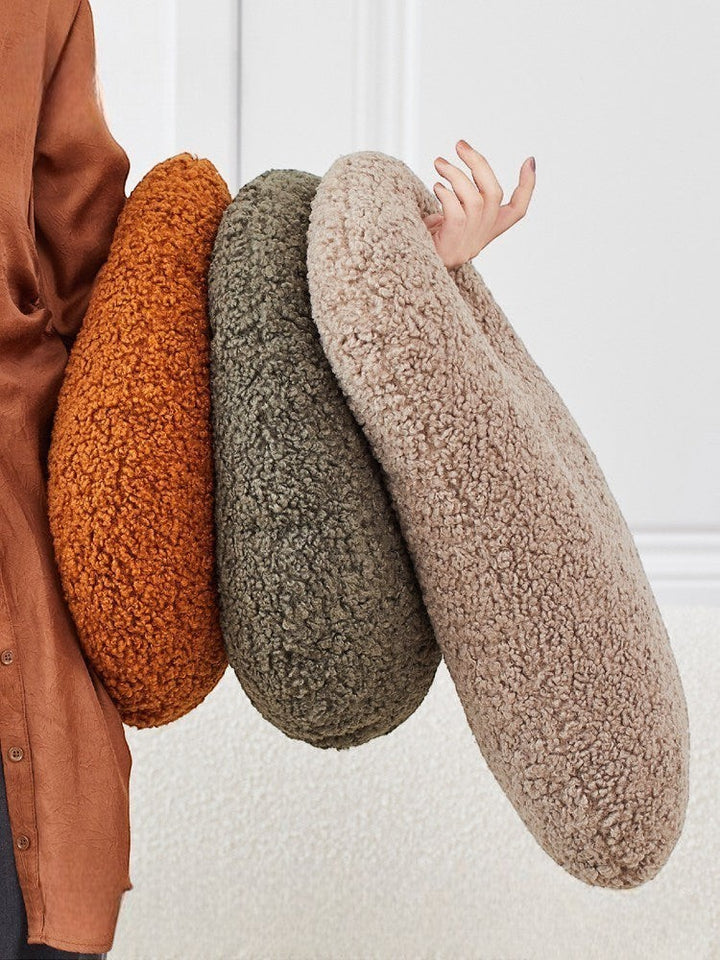 Cosik Home Abstract Bouclé Donut Throw Pillow in terracotta, olive green, and beige. Organic shape with cutout.
