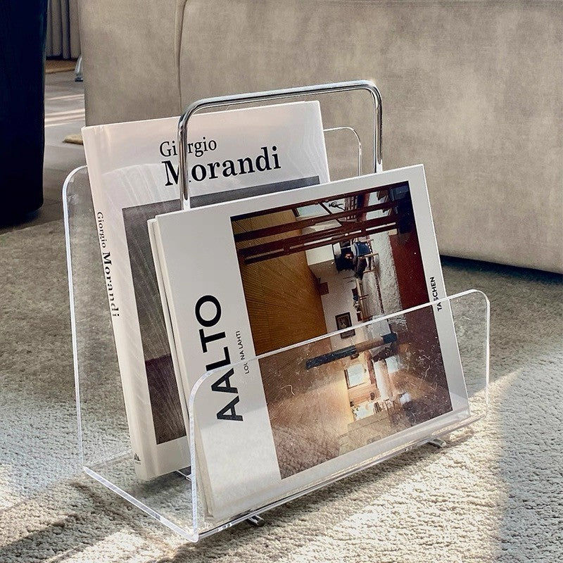 Cosik Home clear acrylic magazine book rack with chrome handle, holding several magazines.