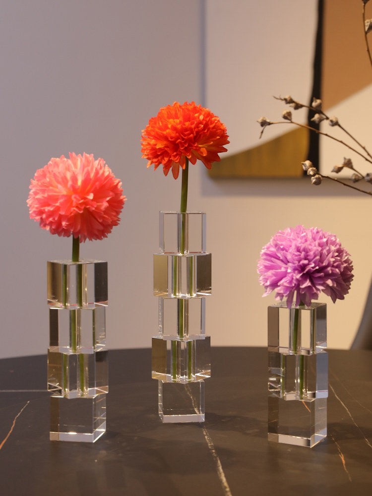 Cosik Home modern Nordic crystal glass vases with pink, orange, and purple flowers. Transparent, stackable cube design.