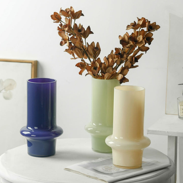 Cosik Home set of 3 glass vases in blue, light green, and cream, featuring a vintage design with a bulbous base and cylindrical top, perfect for fresh or dried flowers.