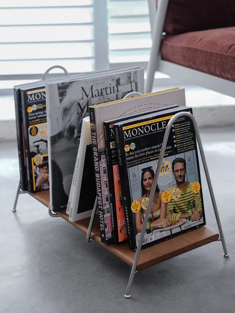 Cosik Home modern metal and wood magazine rack holding several magazines and books.