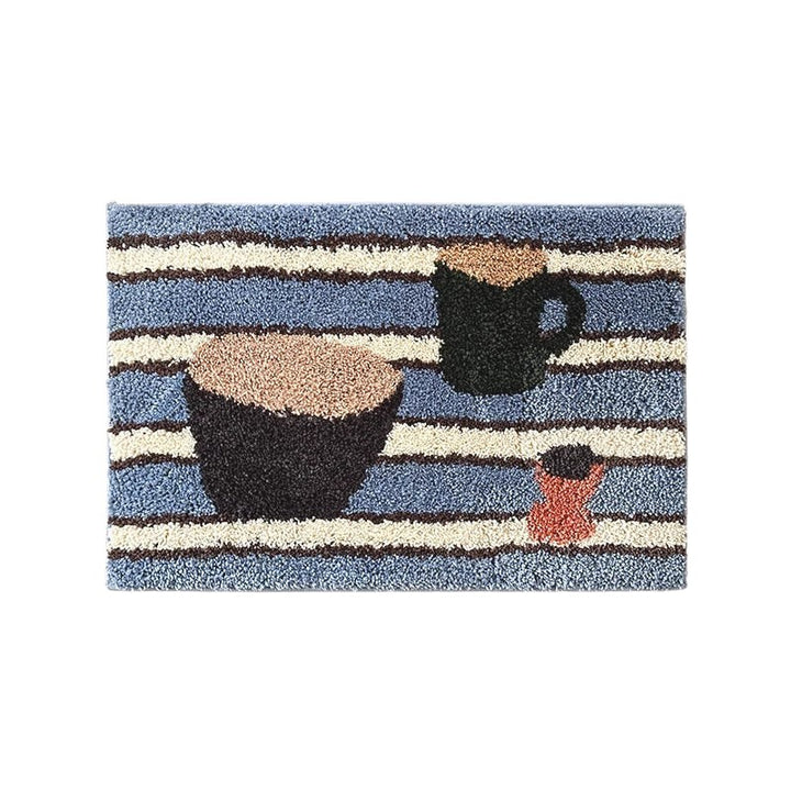 Cosik Home retro tufted plush bath mat with blue, cream, and brown stripes featuring a bowl, mug, and small cup graphic.