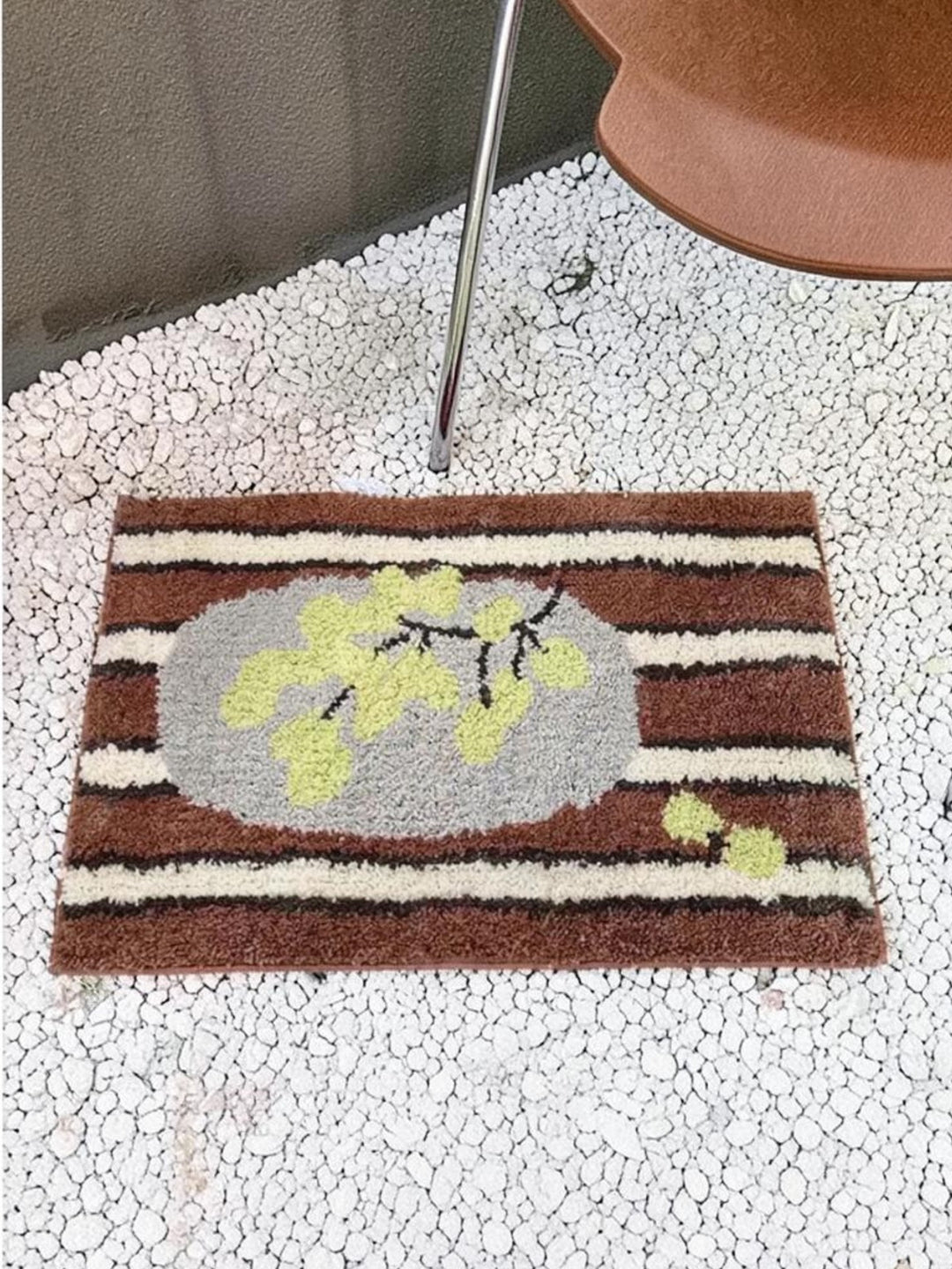 Cosik Home retro tufted plush bath mat with brown, white, and grey stripes and a light green floral design.
