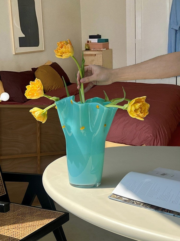 Cosik Home turquoise glass vase with ruffled edge and yellow dot accents, holding yellow tulips.