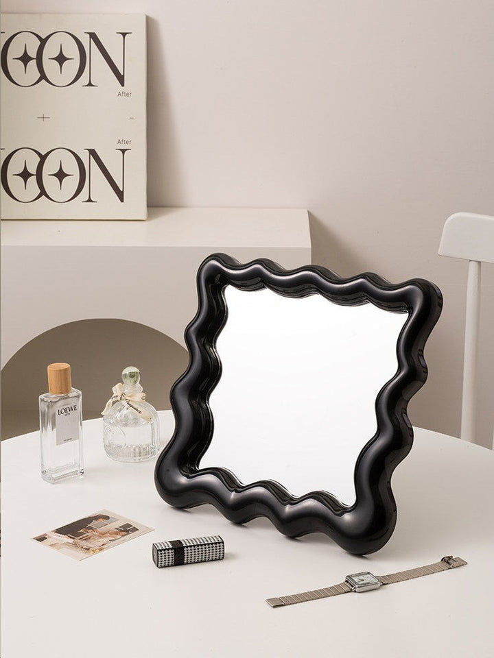 Cosik Home black wavy mirror tray with undulating bubble frame, perfect for vanity or desk display.