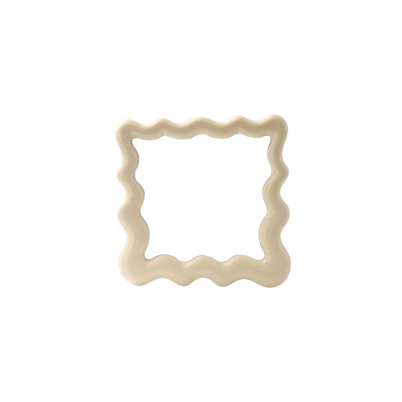 Cosik Home wavy mirror tray with undulating bubble frame, perfect for vanity or desk display. Cream color.