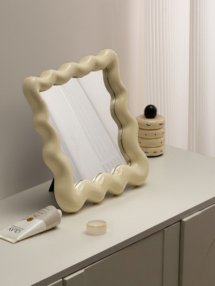 Cosik Home wavy cream vanity tray mirror with undulating bubble frame, perfect for perfumes and decor.